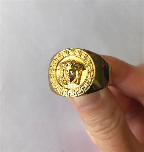 18k gold versace ring.